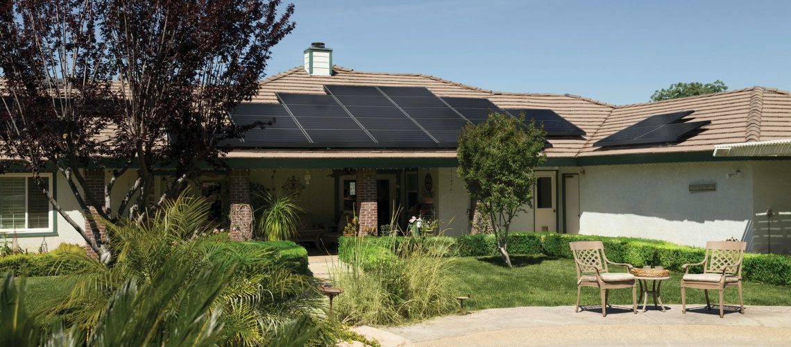 black solar panels on brown roof 2850347